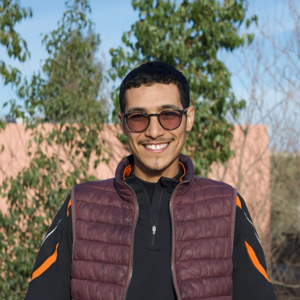 young man smiling with sunglasses